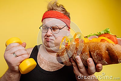 Fat man choise between sport and fastfood Stock Photo