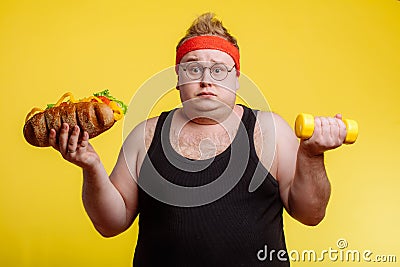 Fat man choise between sport and fastfood Stock Photo