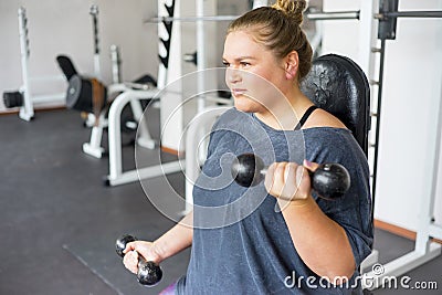 Fat girl in a gym Stock Photo