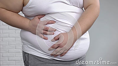 Fat male suffering internal organs pain, metabolic disorder, liver inflammation Stock Photo