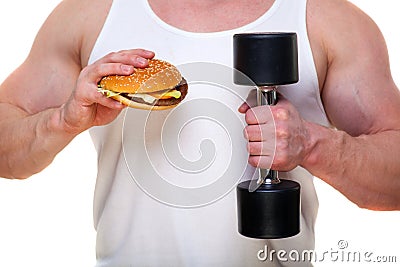 Fat man with a hamburger holds dumbbells on white. The concept of choosing between harmful food and a healthy Stock Photo