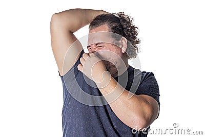 Fat man holds or pinches his nose shut because of a stinky smell or odor Stock Photo