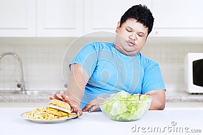 Fat man refuse junk food Stock Photo