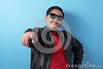 Fat rich Asian boy smiling at camera with proud Stock Photo