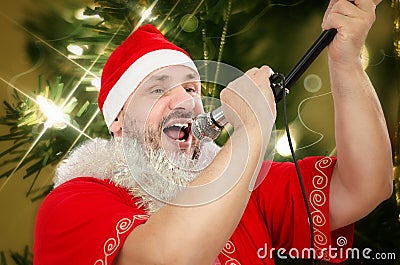 Fat Santa belting Jingle Bells Stock Photo