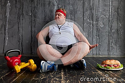 Fat serious man refuses junk unhealthy food Stock Photo