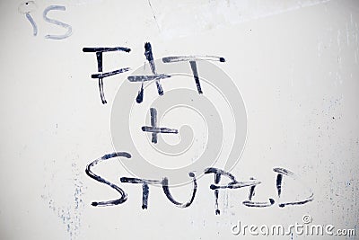 Fat and stupid graffiti Stock Photo