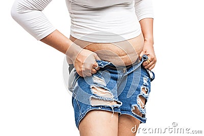 Fat teen girl tried wear Trousers. Stock Photo