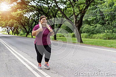 Fat woman asian running, Does exercise for weight loss Stock Photo
