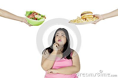 Fat woman looks confused on the studio Stock Photo