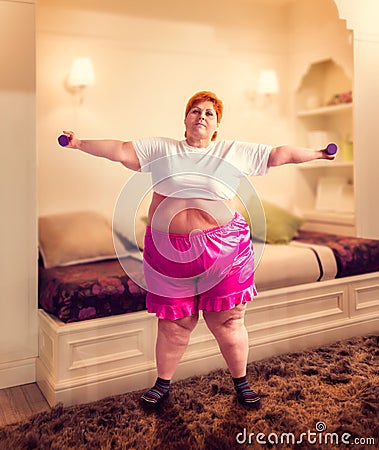 Fat woman on training, fight against obesity Stock Photo