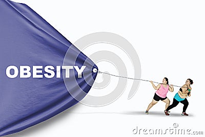 Fat women dragging Obesity text Stock Photo