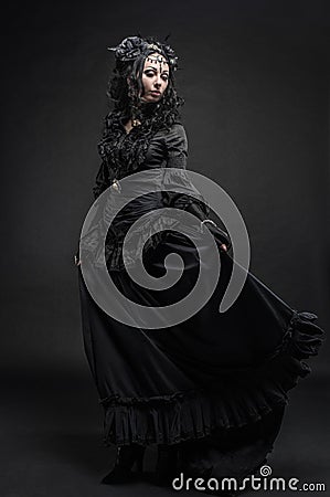 Fatal woman in vintage black dress Stock Photo