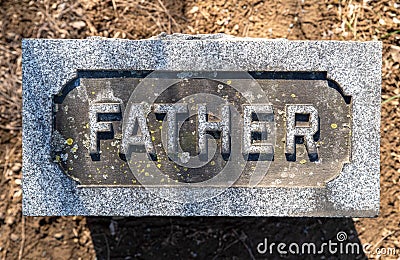 Close up of FATHER cemetery grave stone Stock Photo