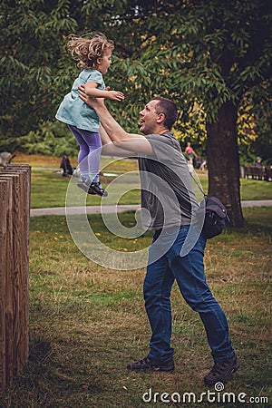 Father catching daughter Stock Photo