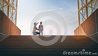 Father and child climb upstairs. Stock Photo