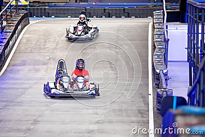 Father and child, son, having fun at gokart carting car race Stock Photo