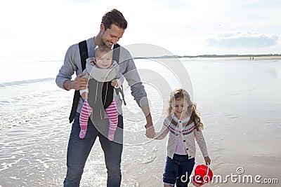 Father with Children on the Beach Stock Photo