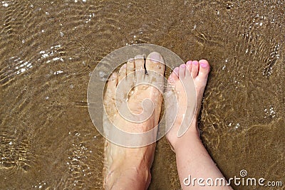 Father and children feet on summer sand beach Stock Photo