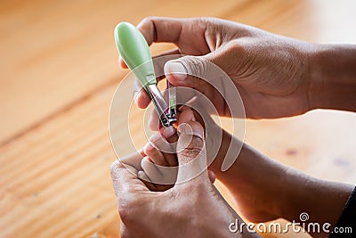 Father cutting toenails for her baby Stock Photo