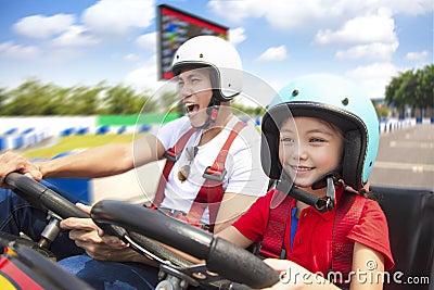Father and daughter driving go kart Stock Photo