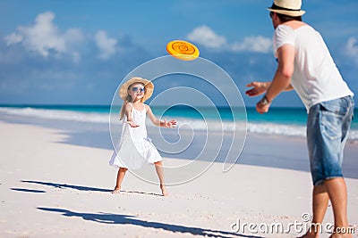 Father and daughter playing frisbee Stock Photo