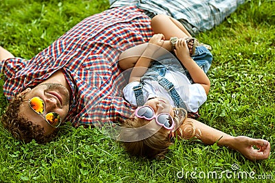 Father and daughter playing in the park in love Stock Photo