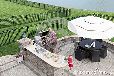 Father and daughter preparing a barbecue Stock Photo