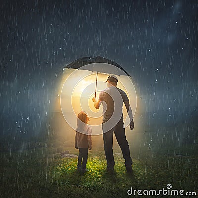 Father and Daughter in the Rain Stock Photo