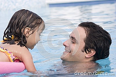 Father and daughter in Swimming pool Stock Photo