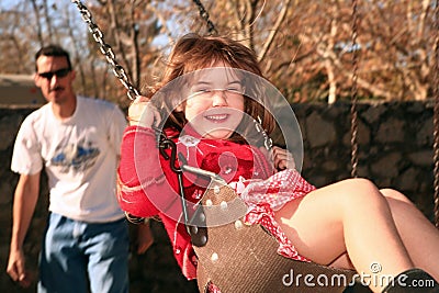 Father And Daughter Swinging On The Park Stock Image CartoonDealer