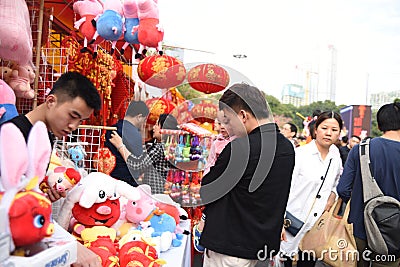 A father and a daughter is visiting the Chinese new year market Editorial Stock Photo