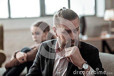 Father with facial wrinkles feeling awful after family conflict Stock Photo