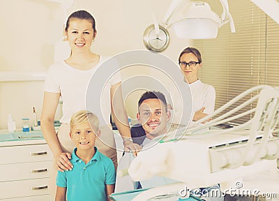 Father of the family is sitting in dental chair Stock Photo