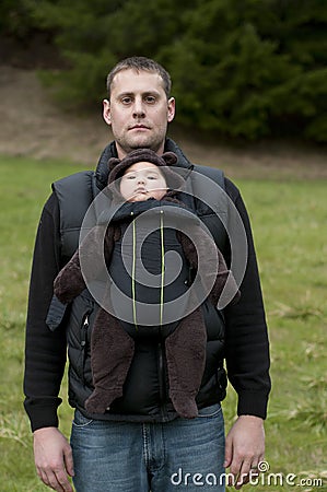 Father with Front Baby Carrier Stock Photo