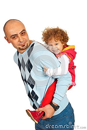 Father giving piggyback ride to her girl Stock Photo