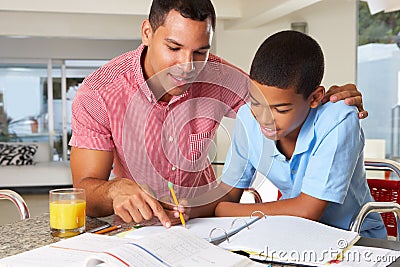 Father Helping Son With Homework Stock Photo