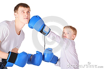 Father and his son is boxing with boxing gloves Stock Photo