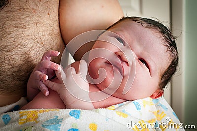 Father Holding His Newborn Son Stock Photo