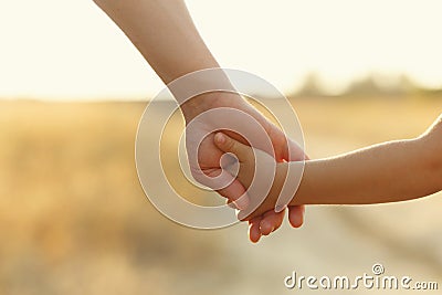 Father holds daughter by the hand Stock Photo