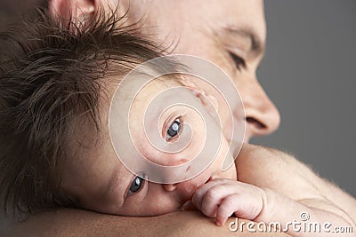 Father Hugging Newborn Baby Stock Photo