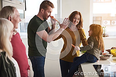 Father and kid playing with food Stock Photo