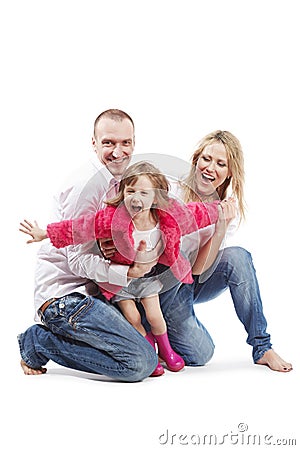 Father, mother and daughter with outstretched arms Stock Photo