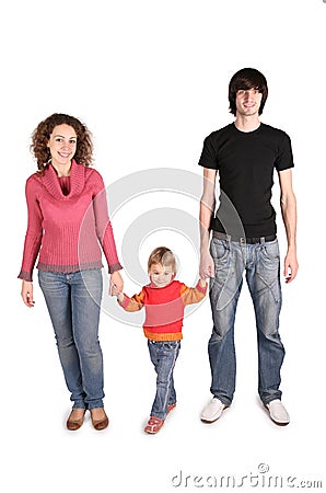 Father and mother hold daughter for hands Stock Photo