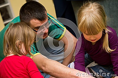 Father playing with children Stock Photo