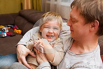 The father plays with the kid Stock Photo