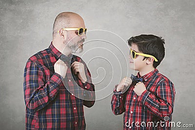 Father`s day,father and son with tie and sunglasses Stock Photo