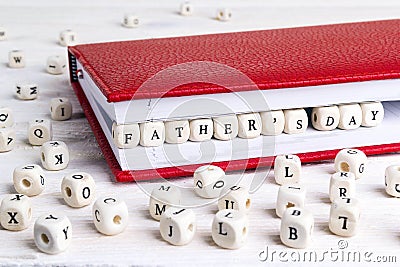 Father`s Day greeting message written in wooden blocks in red no Stock Photo