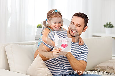 Father`s day. Happy family daughter giving dad greeting card Stock Photo