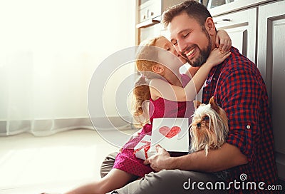 Father`s day. Happy family daughter giving dad greeting card Stock Photo